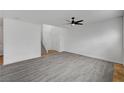Spacious living room with light gray flooring and a modern ceiling fan with lighting at 8789 Villa Alex Ave, Las Vegas, NV 89147