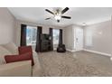 Comfortable living room features natural light, tile flooring, and neutral decor at 903 Billings St, Henderson, NV 89002