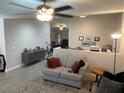 Open-concept living area with plush seating and a view of the dining area at 903 Billings St, Henderson, NV 89002