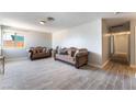 Spacious living room with wood-look tile flooring and light gray paint at 908 N 24Th St, Las Vegas, NV 89101