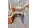 The bright kitchen features stainless steel appliances and ample counter space at 10455 Alpine Edge Ave, Las Vegas, NV 89129