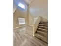 Bright living room with high ceilings and a staircase at 10455 Alpine Edge Ave, Las Vegas, NV 89129