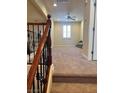 Hallway leading into a carpeted sitting area with natural light at 11625 Cabo Del Verde Ave, Las Vegas, NV 89138