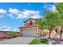 Charming two-story home with a tan exterior, tile roof, and an attached two-car garage at 11787 Fern Creek Ln, Las Vegas, NV 89183