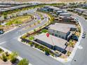 Stunning aerial view of a modern home with landscaped yard in a vibrant community setting at 12565 Huckleberry Oak Ave, Las Vegas, NV 89138