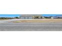 Single-story home boasts a three-car garage and spacious surrounding land at 1351 Huckleberry St, Pahrump, NV 89048