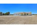 Single-story home with three-car garage offering ample parking and generous land area at 1351 Huckleberry St, Pahrump, NV 89048