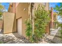 Exterior view of the side of the property showing landscape and entrance gate at 1448 Canyon Ledge Ct, Las Vegas, NV 89117
