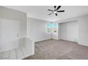 Inviting living room with neutral decor, plush carpeting, and ample natural light from windows at 1505 Blackcombe St # 202, Las Vegas, NV 89128