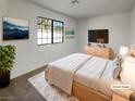 Comfortable bedroom with a large window and modern decor at 1832 Yellow Rose St, Las Vegas, NV 89108