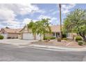 Beautiful single-story home with lush landscaping and a spacious two-car garage with driveway at 1845 Candle Bright Dr, Henderson, NV 89074