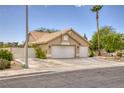 Inviting single-story home with a two-car garage and driveway in a quiet neighborhood at 1845 Candle Bright Dr, Henderson, NV 89074