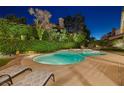 Relaxing backyard pool and spa area with lounge chairs for soaking up the sun at 1921 Spyglass Dr, Henderson, NV 89074