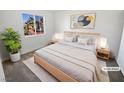 Cozy bedroom with natural light, neutral colors, and minimalist decor for relaxation at 2306 Jared Ct, North Las Vegas, NV 89032
