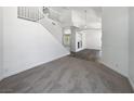 Spacious living room featuring soaring ceilings, staircase and modern finishes at 2306 Jared Ct, North Las Vegas, NV 89032