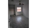 Modest bedroom with a window, built-in shelving, and overhead ceiling fan at 255 S 17Th St, Las Vegas, NV 89101