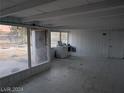 Bright sun room with large windows, a washing machine and access to the backyard at 255 S 17Th St, Las Vegas, NV 89101