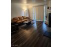 Comfortable living room with access to a balcony, and featuring a cozy fireplace at 2606 S Durango Dr # 214, Las Vegas, NV 89117