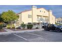 Attractive condo building with mature trees, desert landscaping, and convenient parking at 2725 S Nellis Blvd # 2049, Las Vegas, NV 89121