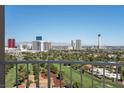 Wide balcony view overlooking a golf course with an expansive cityscape skyline at 3111 Bel Air Dr # 22B, Las Vegas, NV 89109