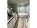 Modern bathroom featuring sleek tiling, contemporary fixtures, and a luxurious soaking tub at 3111 Bel Air Dr # 22B, Las Vegas, NV 89109