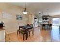 Cozy dining area with natural light and open concept to the kitchen at 3823 Aspen Creek Ave, North Las Vegas, NV 89031