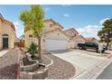 Inviting home exterior showcasing desert landscaping, a two-car garage, and a well-kept facade at 4552 Aviation St, Las Vegas, NV 89115