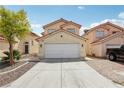 Front view of a two-story home with a well-manicured yard and spacious two-car garage at 4552 Aviation St, Las Vegas, NV 89115