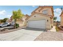 Charming two-story home featuring a spacious driveway leading to a two-car garage at 4552 Aviation St, Las Vegas, NV 89115