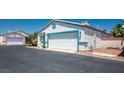 A single-story home featuring a two-car garage and neatly kept surroundings at 5099 Mascaro Dr, Las Vegas, NV 89122