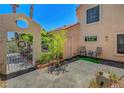 Enclosed front courtyard provides a private seating area at 5237 Crooked Sky Cir, Las Vegas, NV 89149