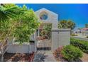 Enclosed front entry featuring a decorative gate and private courtyard at 5237 Crooked Sky Cir, Las Vegas, NV 89149
