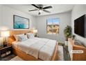 Cozy bedroom with a comfortable bed, soft lighting, and a view of the neighborhood at 5709 Jaysin Douglas St, North Las Vegas, NV 89031