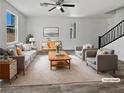 Bright living room featuring stylish furnishings, neutral tones, and plenty of natural light at 5709 Jaysin Douglas St, North Las Vegas, NV 89031