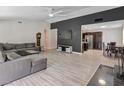 Spacious living room with modern gray decor next to an adjacent dining area at 6436 Vinecrest Ave, Las Vegas, NV 89108