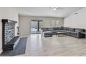 Bright living room boasts a fireplace and sliding door access to the pool area at 6436 Vinecrest Ave, Las Vegas, NV 89108