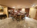 Spacious kitchen with a large center island, seating, stainless steel appliances, and modern finishes at 6729 Flamenco Ct, Las Vegas, NV 89139