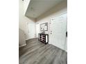 Entryway features wood-look flooring and a white interior door at 6812 Dipper Ave, North Las Vegas, NV 89084