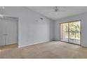 Spacious bedroom with a ceiling fan and sliding glass door leading to a balcony at 8000 Badura Ave # 2174, Las Vegas, NV 89113