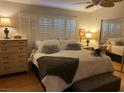 Inviting bedroom with soft textures, shutters and ample natural light at 8450 Alta Dr # 204, Las Vegas, NV 89145