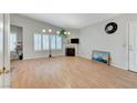Bright living room offers ample space with wood floors, fireplace, and natural light at 8450 Alta Dr # 204, Las Vegas, NV 89145