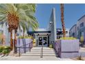 Building entrance featuring modern design, steps, and landscaping at 9050 W Tropicana Ave # 1170, Las Vegas, NV 89147