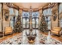 Ornate lobby featuring custom marble flooring, designer chandeliers, and seating near large windows at 9103 Alta Drive Dr # 407, Las Vegas, NV 89145