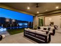 Covered patio overlooking pool with water features, perfect for outdoor relaxation and entertaining at 10228 Shell Star Ave, Las Vegas, NV 89135