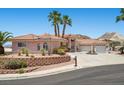 Charming single Gathering home showcases a circular driveway and lush landscaping at 1105 Malachite Ct, Henderson, NV 89011