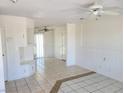 Spacious living area with tile flooring, neutral walls, built-in shelving and access to the backyard at 129 Maple St, Henderson, NV 89015