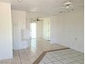 Bright living room with tile floors, paneled walls, and built-in shelves offering a classic design at 129 Maple St, Henderson, NV 89015