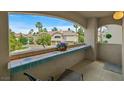Balcony showcasing view of community, tiled counter and outdoor seating at 2050 W Warm Springs Rd # 823, Henderson, NV 89014
