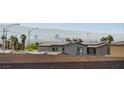View of the city skyline and mountains from a house with solar panels at 226 White Crest Peak Ave, Henderson, NV 89015