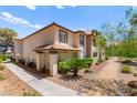 Attractive multi-Gathering home with lush landscaping and walkway at 2606 S Durango Dr # 245, Las Vegas, NV 89117